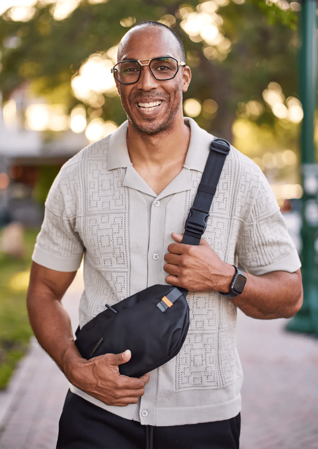 Man wearing glasses and a fanny pack